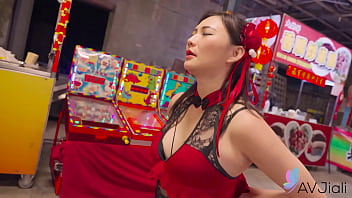 A Sultry Chinese Beauty Gets Wild And Wet In The Night Market’s Shadows.