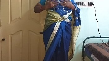 A Lustful Indian Housewife From The South, Draped In A Seductive Blue Saree, Flaunts Her Ample Bosom And Smooth, Shaved Pussy While Teasing Her Hard Nipples And Rubbing Her Wet Slit In A Wild Solo Session.