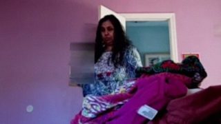 Peeping On A Voluptuous Indian Aunty Undressing In Her Bedroom
