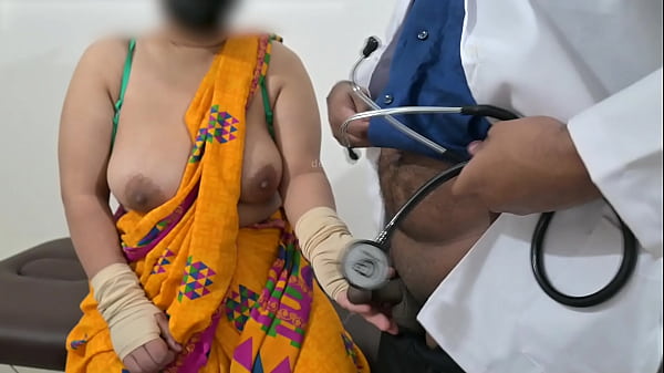 Nurse’s Hands On Mature Indian Woman’s Chest During Medical Exam